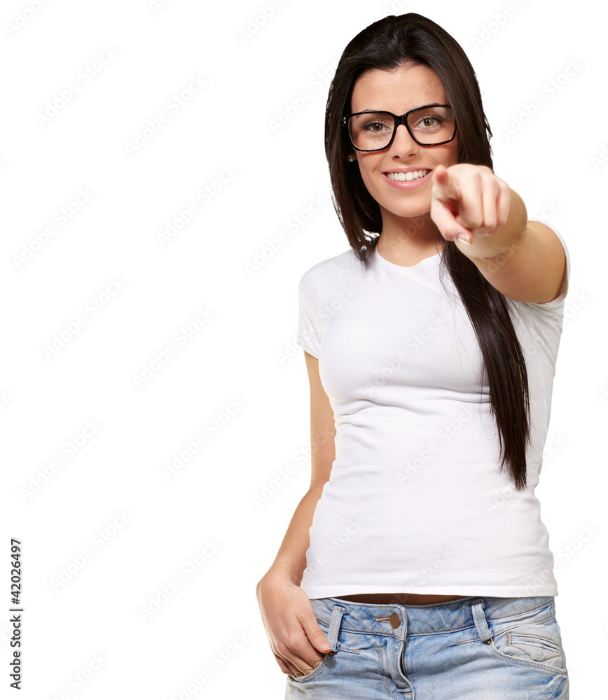 portrait of young woman pointing with finger against a white bac portrait of young woman pointing with finger against a white bac