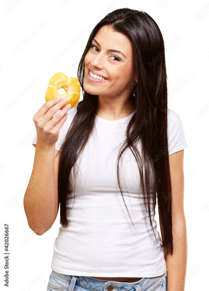 portrait of young woman eating a donut over white portrait of young woman eating a donut over white