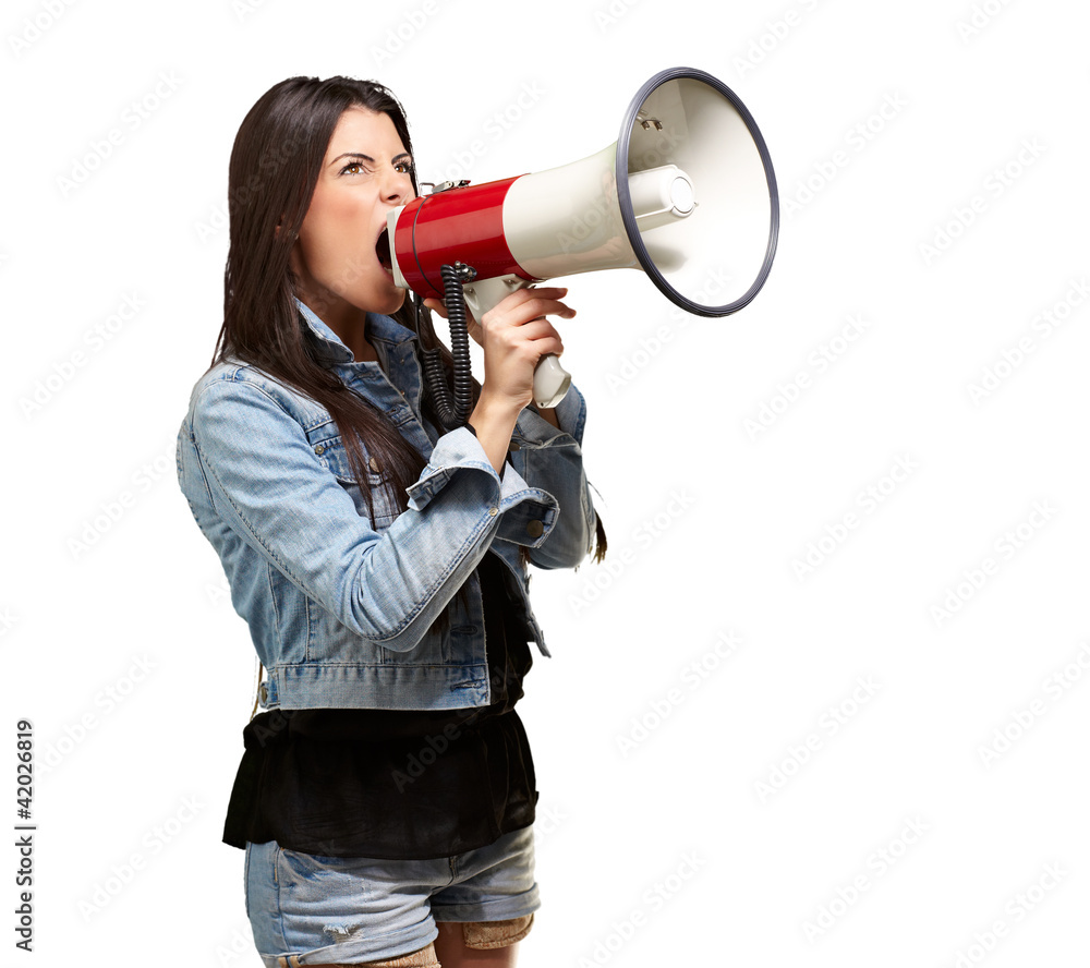 portrait of young woman screaming with megaphone against a white portrait of young woman screaming with megaphone against a white