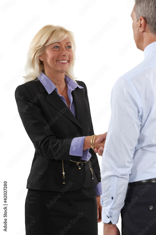 Two senior businesspeople shaking hands Two senior businesspeople shaking hands