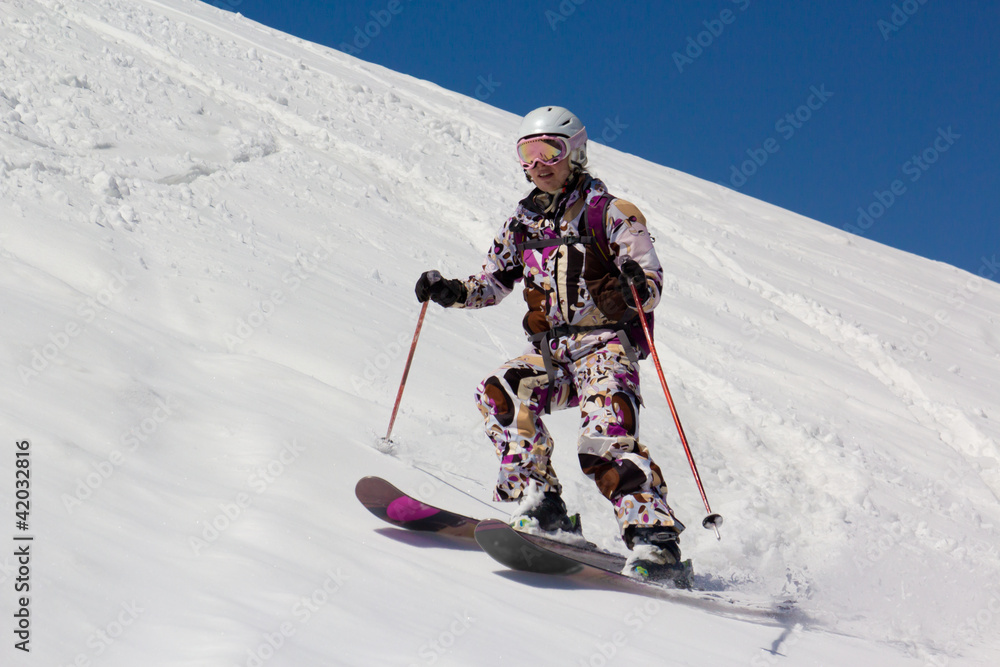 Woman skier in the soft snow.