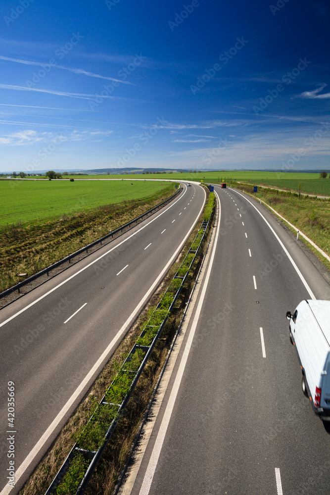 Fototapeta premium highway traffic on a lovely, sunny summer day