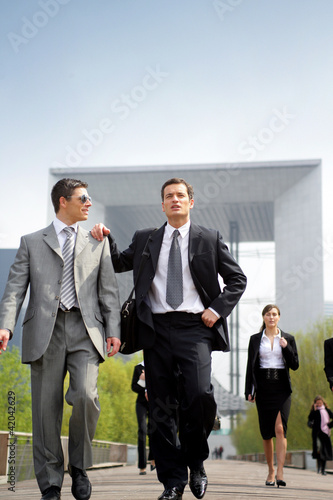 Businesspeople walking outdoors