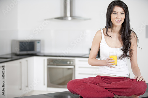 Young woman enjoying a glass of juice