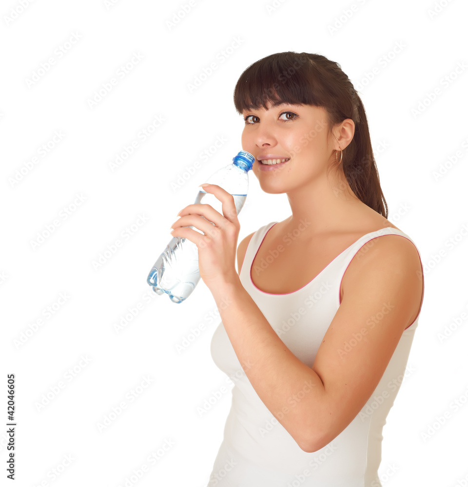 Woman drinking water from bottle, isolated on white background Woman drinking water from bottle, isolated on white background