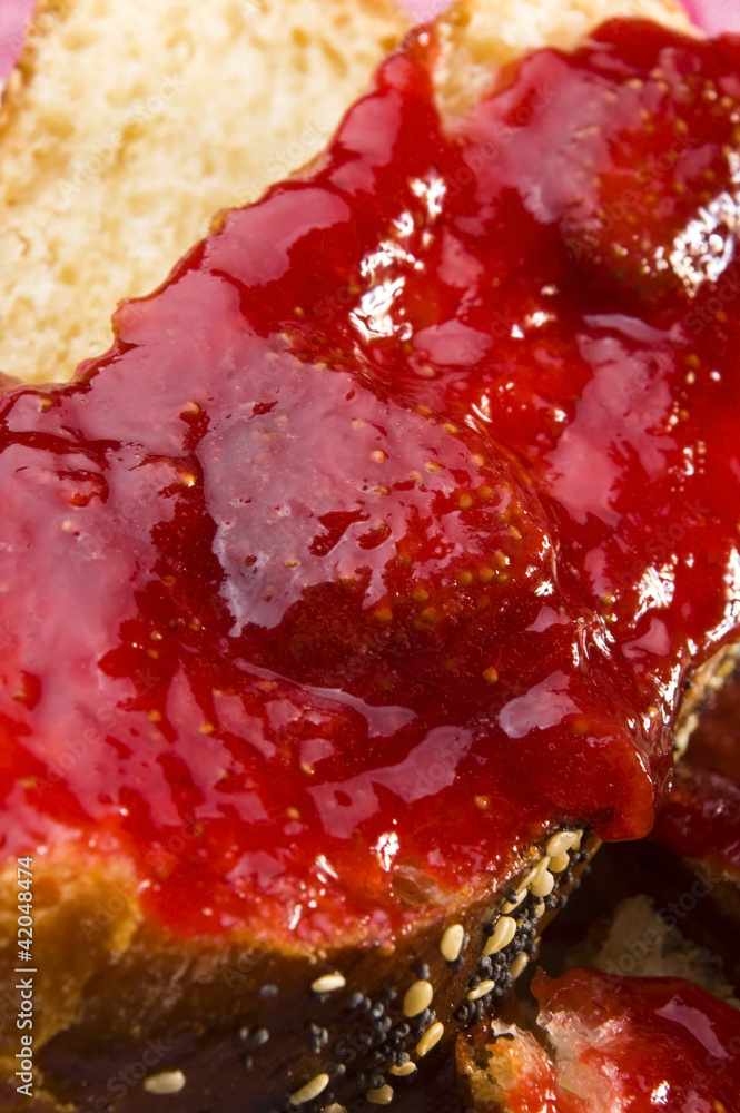 Obraz premium Sweet bread ( challah ) with strawberry jam