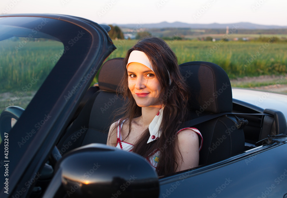 Naklejka premium Woman in the car