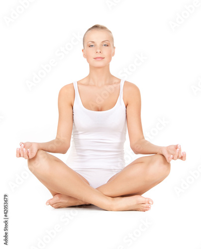 woman in cotton undrewear practicing lotus pose