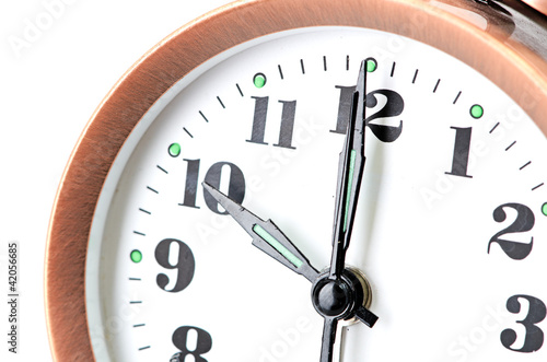 bronze vintage alarm clock isolated on white background