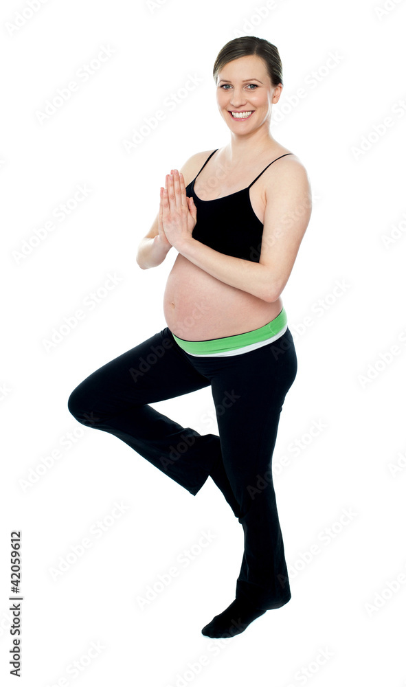 Beautiful pregnant woman doing yoga Beautiful pregnant woman doing yoga