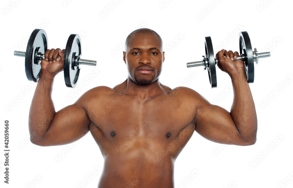 Shirtless african male holding dumbbells Shirtless african male holding dumbbells