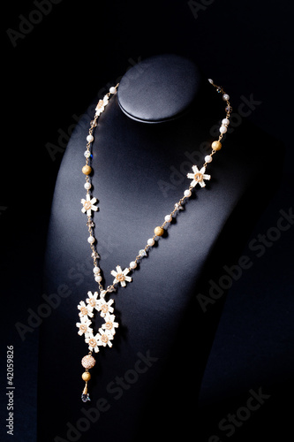 luxury jewellery pearl set necklace over black background
