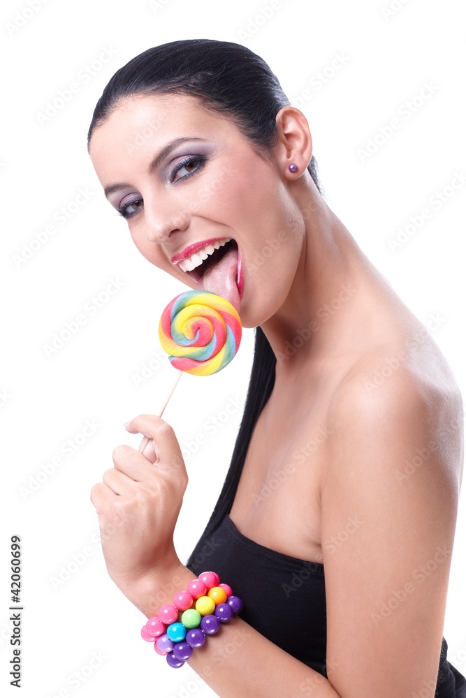 Sexy woman licking lollipop smiling