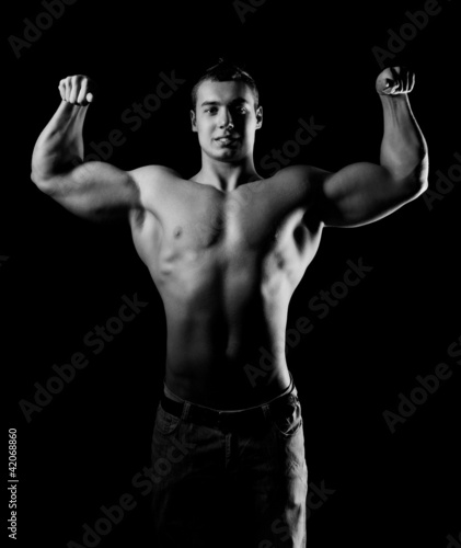 Bodybuilder showing his muscles