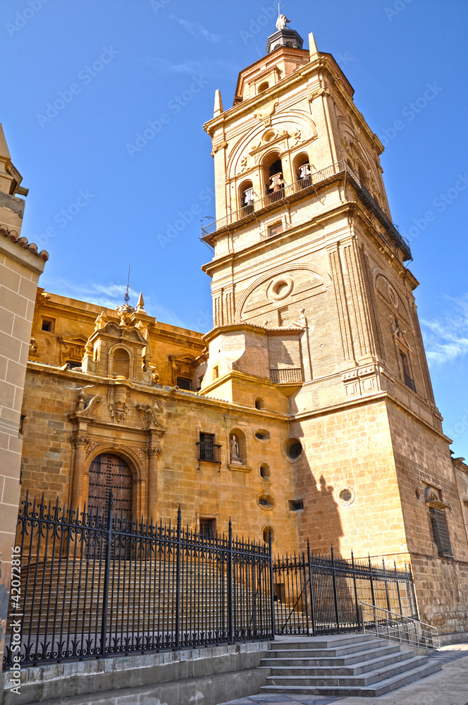 Catedral de Guadix, torre-campanario y portada lateral