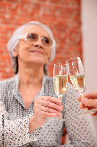 Woman toasting in restaurant
