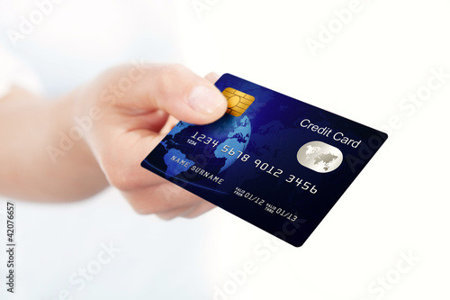 blue credit card holded by hand