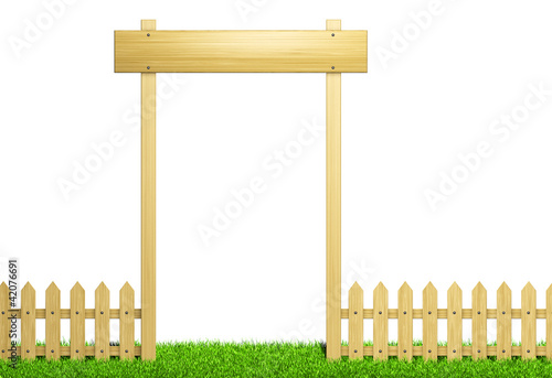 Green field and wooden fence