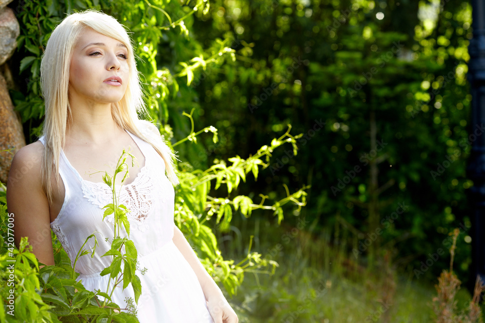 close-up portrait of beautiful young blond woman in white blouse close-up portrait of beautiful young blond woman in white blouse