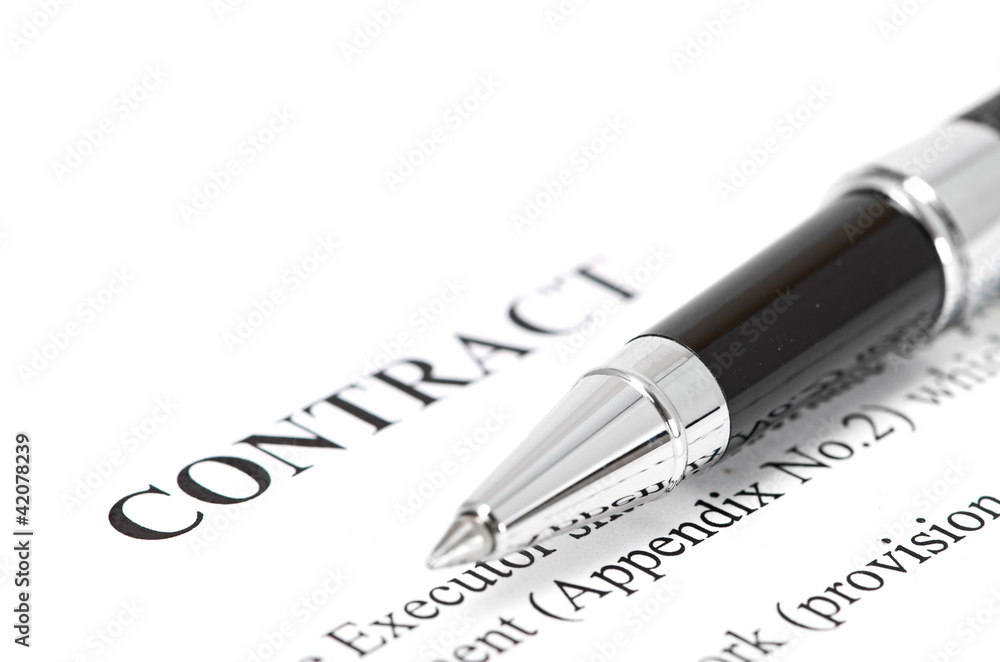 Close-up of silver pen on contract. Close-up of silver pen on contract.
