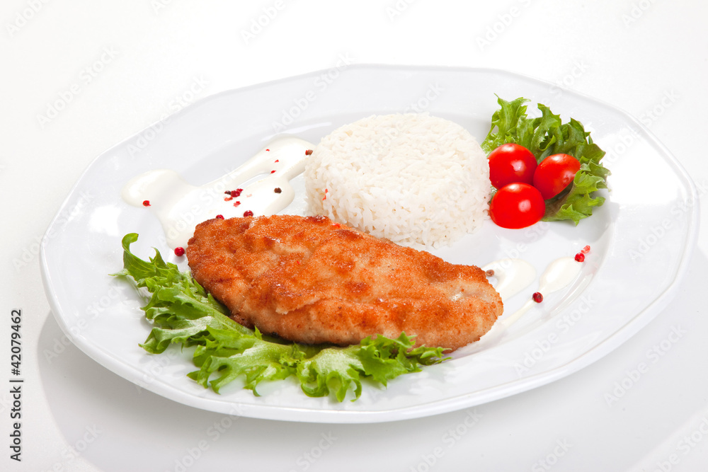 meat with mixed leaf salad an rice on white meat with mixed leaf salad an rice on white