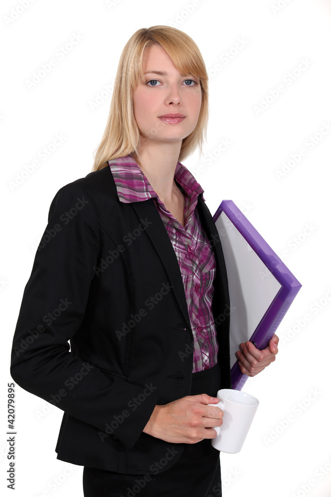 secretary holding folders and a cup of coffee secretary holding folders and a cup of coffee