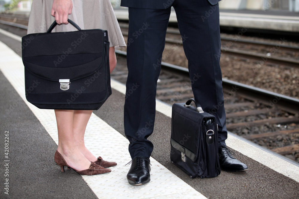 Businesspeople waiting at the trainstation