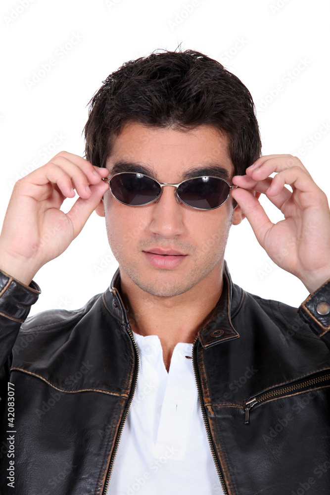 handsome man wearing leather jacket and sunglasses handsome man wearing leather jacket and sunglasses