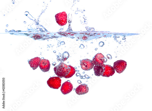 Red Raspberries Falls under Water with a Splash