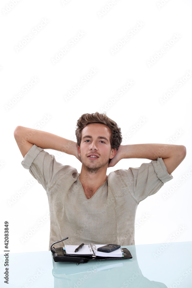 young man with agenda having a break young man with agenda having a break