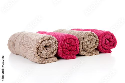 Four rolled colorful towels