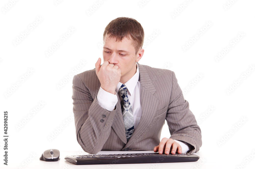 businessman in a suit sitting at a laptop businessman in a suit sitting at a laptop