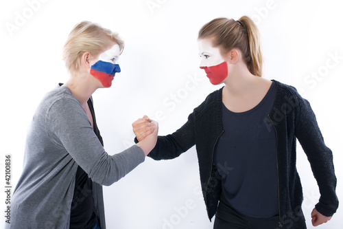 фотографія Football soccer fans arm wrestling