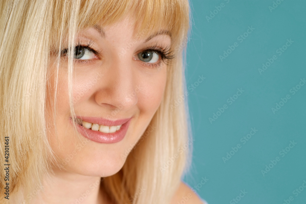 Portrait of a beautiful nice blonde Caucasian lady with flowers Portrait of a beautiful nice blonde Caucasian lady with flowers