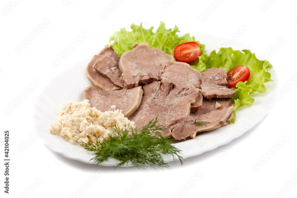 Boiled veal tongue with greens and a horse-radish