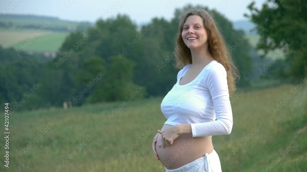 7 months crazy pregnant woman outdoor in nature have fun 7 months crazy pregnant woman outdoor in nature have fun