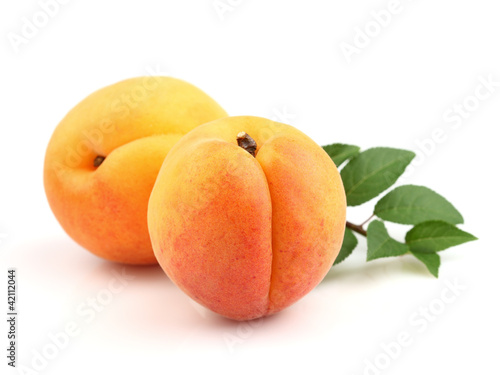 Ripe apricots with leaves