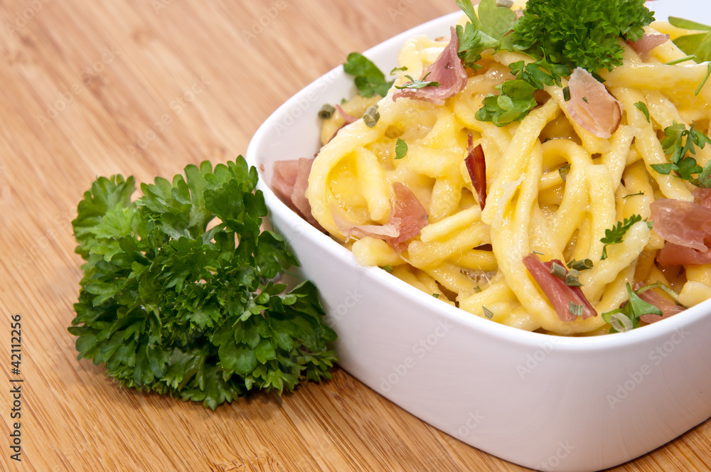 Portion of Cheese Spaetzle decorated with Parsley Portion of Cheese Spaetzle decorated with Parsley