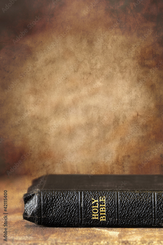 Fototapeta premium Bible with Grunge Stone Background