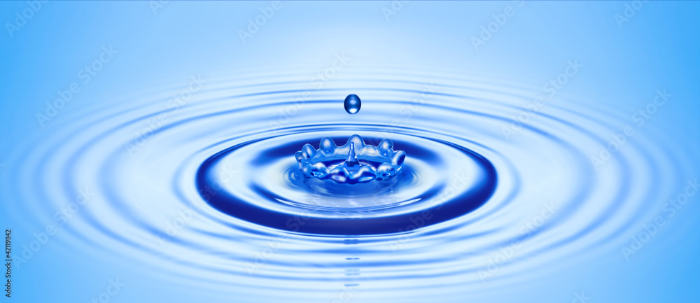 water drop created ripple and splash in crown shape water drop created ripple and splash in crown shape