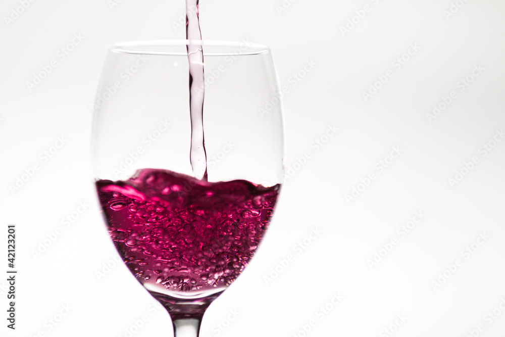 Glass of wine being filled Glass of wine being filled