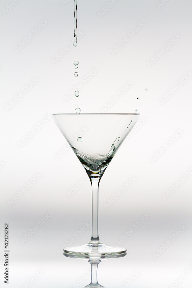 Drops of liquor falling into a cocktail glass Drops of liquor falling into a cocktail glass