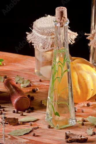 Oil bottle in front of ingredients photo