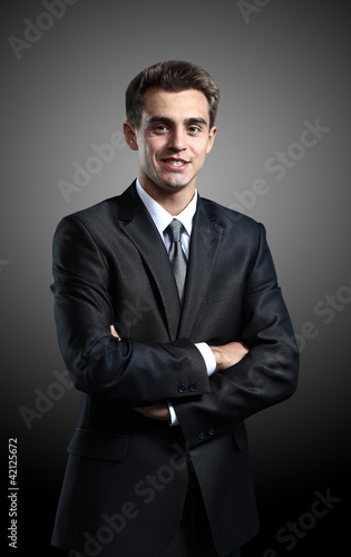 Portrait of successful business man standing on © ASDF