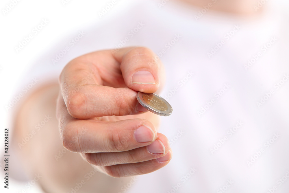 Young caucasian man holding a two euro coin. Young caucasian man holding a two euro coin.