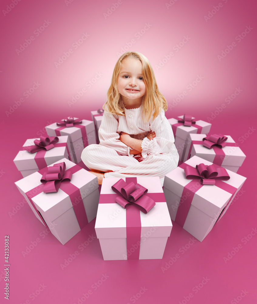 Happy little girl surrounded by gifts pink Happy little girl surrounded by gifts pink