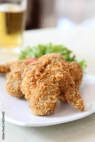 Fried Chicken with tomato vegetable and beer