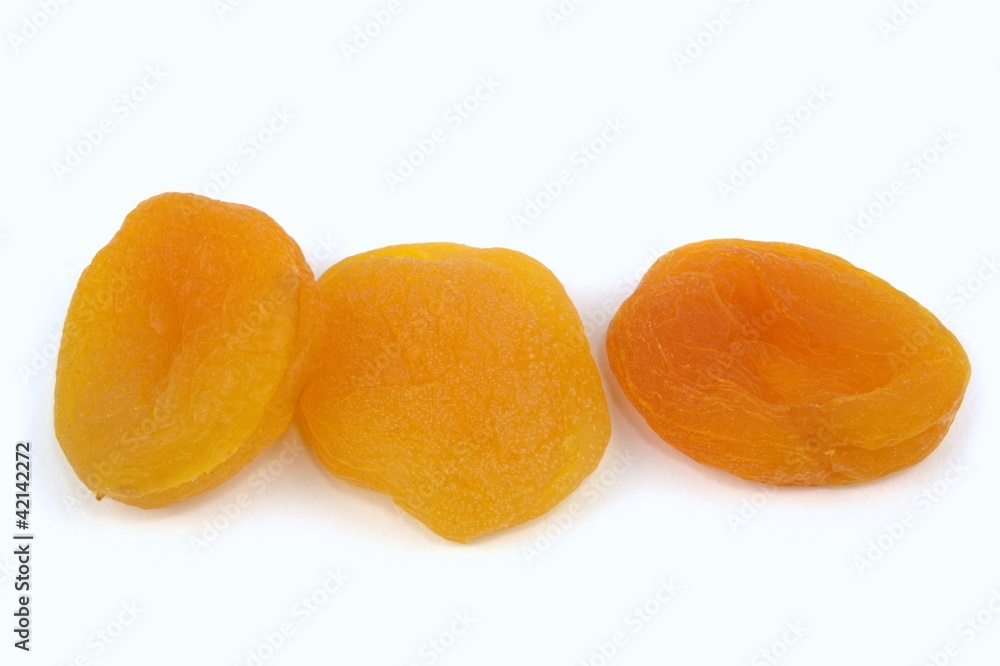 Sun dried apricots on white background. Sun dried apricots on white background.