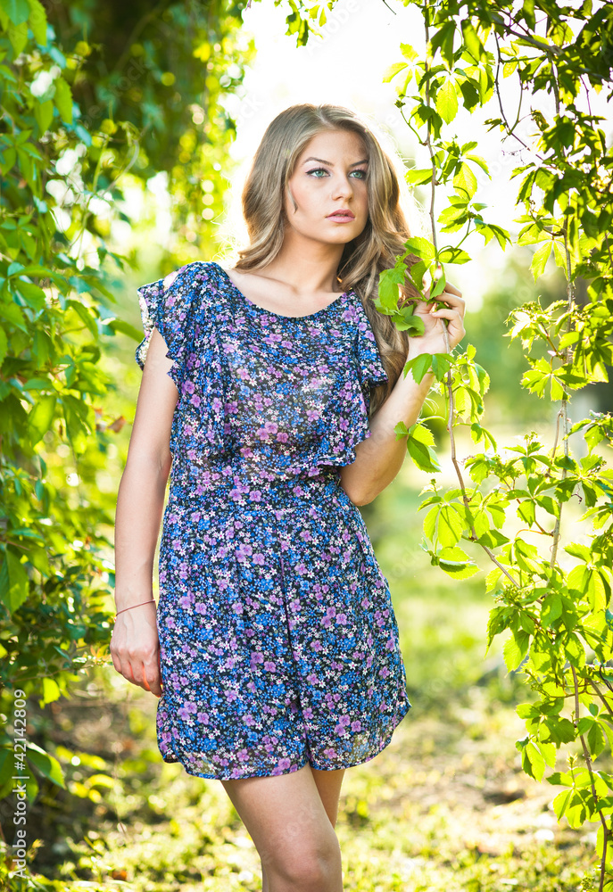 Young attractive girl with blue dress outdoor on the field Young attractive girl with blue dress outdoor on the field
