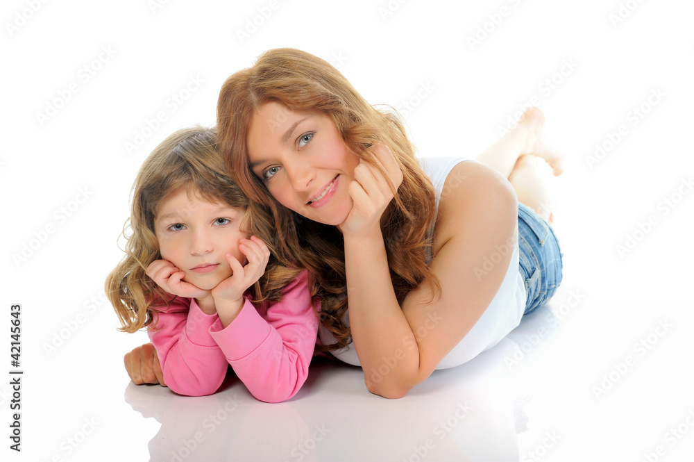 cheerful girl hugs her young mother. cheerful girl hugs her young mother.